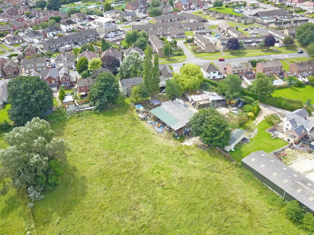 Aerial photograph of the Beeholme Farm site, with existing buildings, trees and neighbouring homes